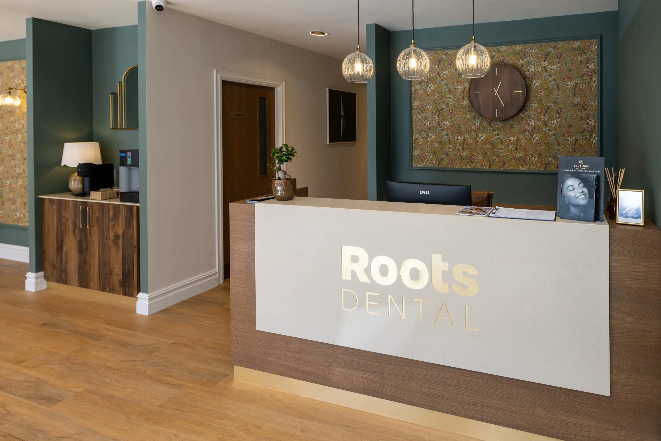 Backlit Roots Dental reception desk in Morpeth, delivered under our project management contract